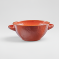 Ciotola terracotta su sfondo grigio