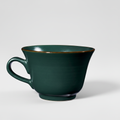 Tazza verde su sfondo grigio