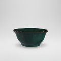 Ciotola verde ceramica su sfondo grigio con ombra