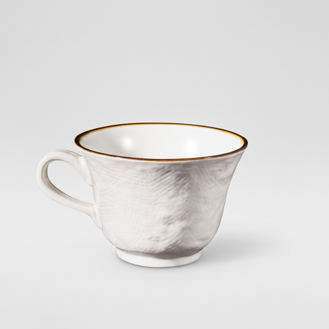 Tazza bianca su sfondo grigio