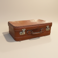 Valigia originale vintage in cuoio cognac su sfondo beige