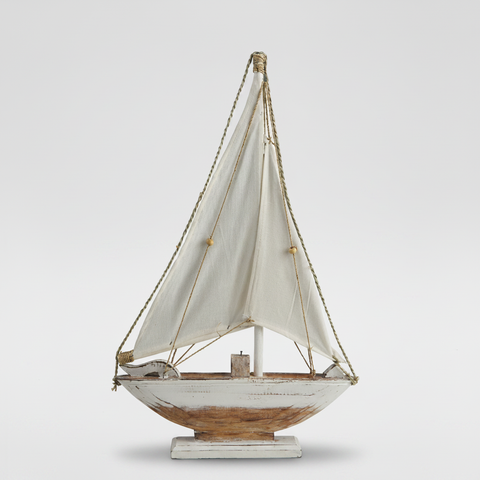 Barca a vela decorativa su sfondo grigio con ombra