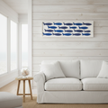 Quadro pesci blu coastal appeso in living beach house