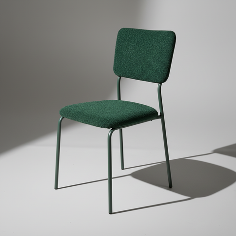 Sedia bouclé verde girata verso sinistra