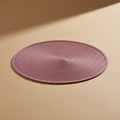 Sottopiatto rosa Placemate su sfondo neutro