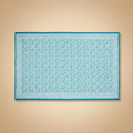 Tovaglietta block print turchese su sfondo beige