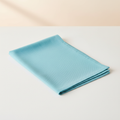 Tovagliolo azzurro turchese su sfondo beige