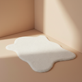 White sheepskin rug against wall